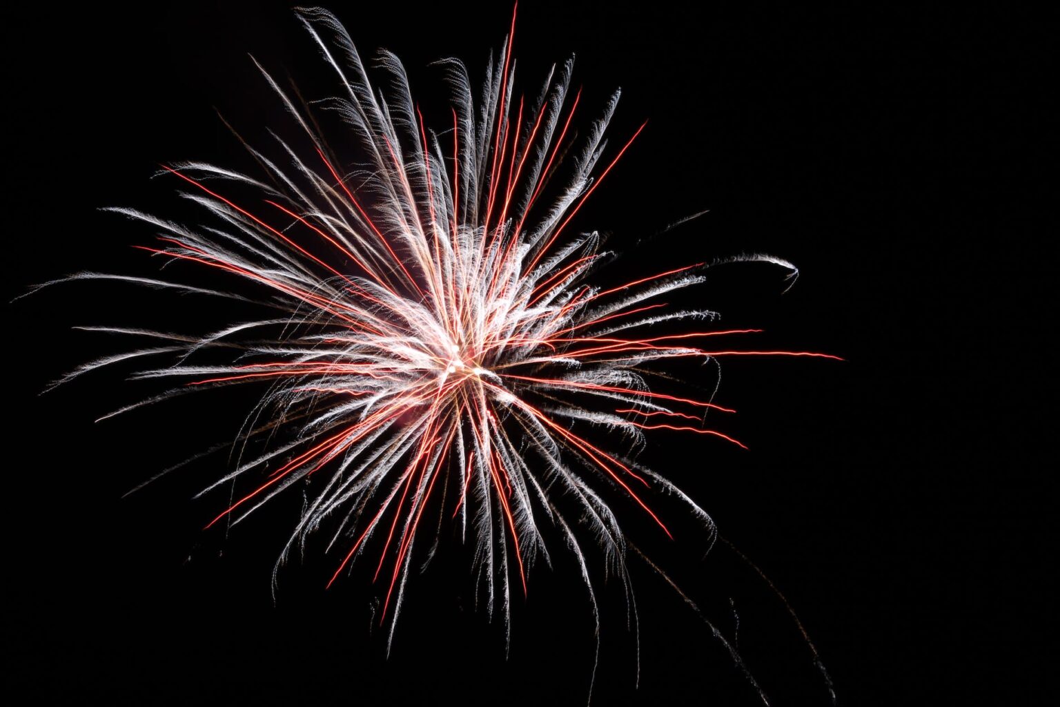 white and red firework burst