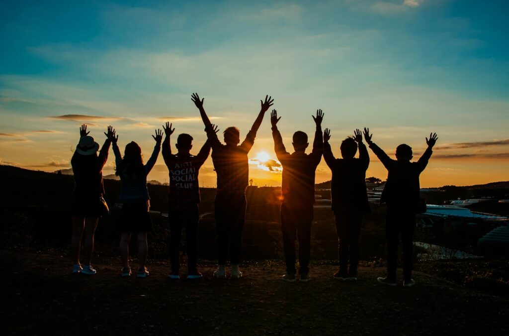 people silhouette during sunset