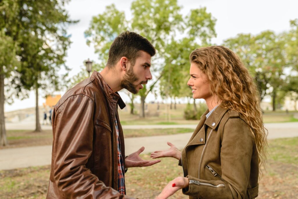 man and woman wearing brown leather jackets