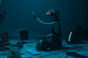 a woman in a tank top using a vr headset