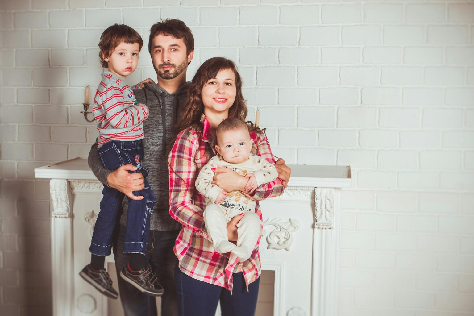 standing family near fireplace