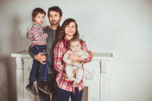 standing family near fireplace