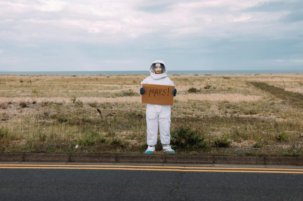 person in a costume hitchhiking