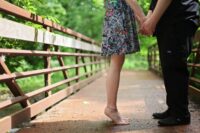 couple standing on bridge