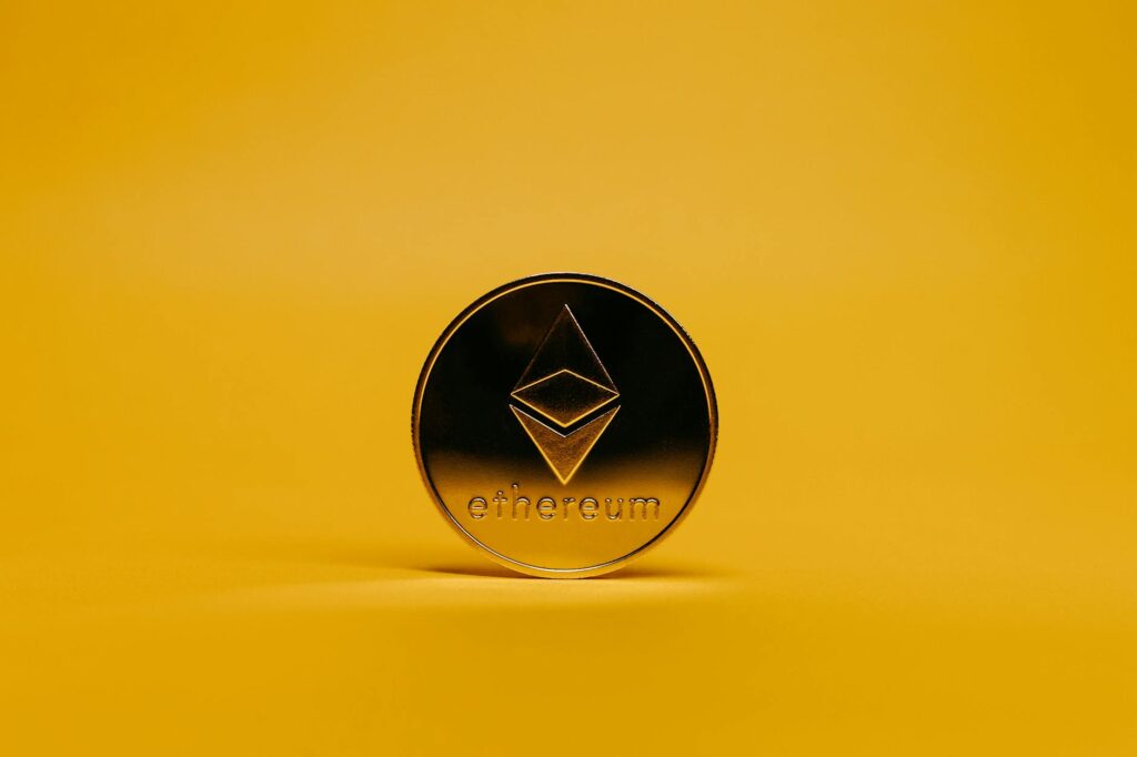 ethereum coin on yellow background