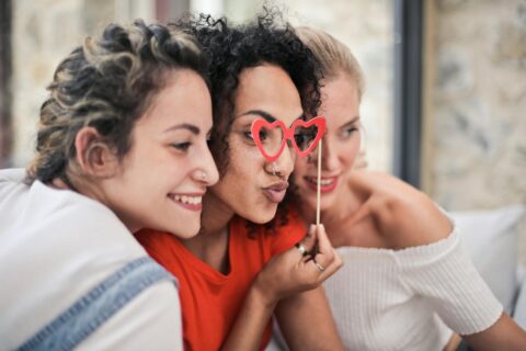 three women posing for photo