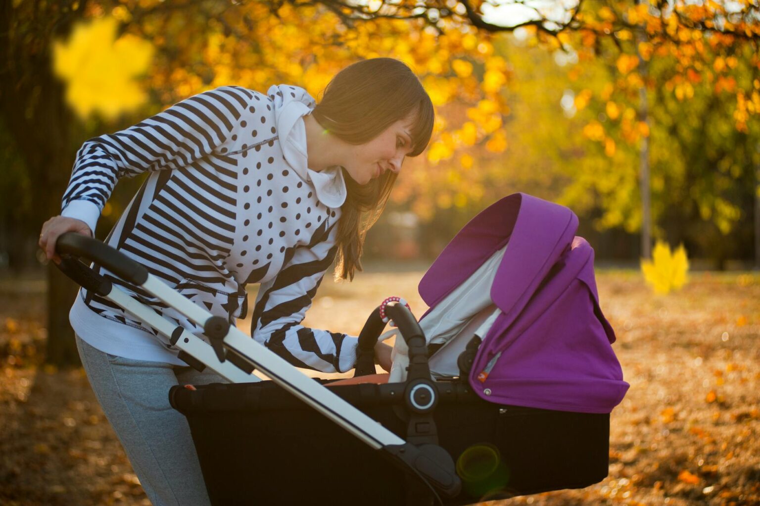 photo of a woman looking her baby