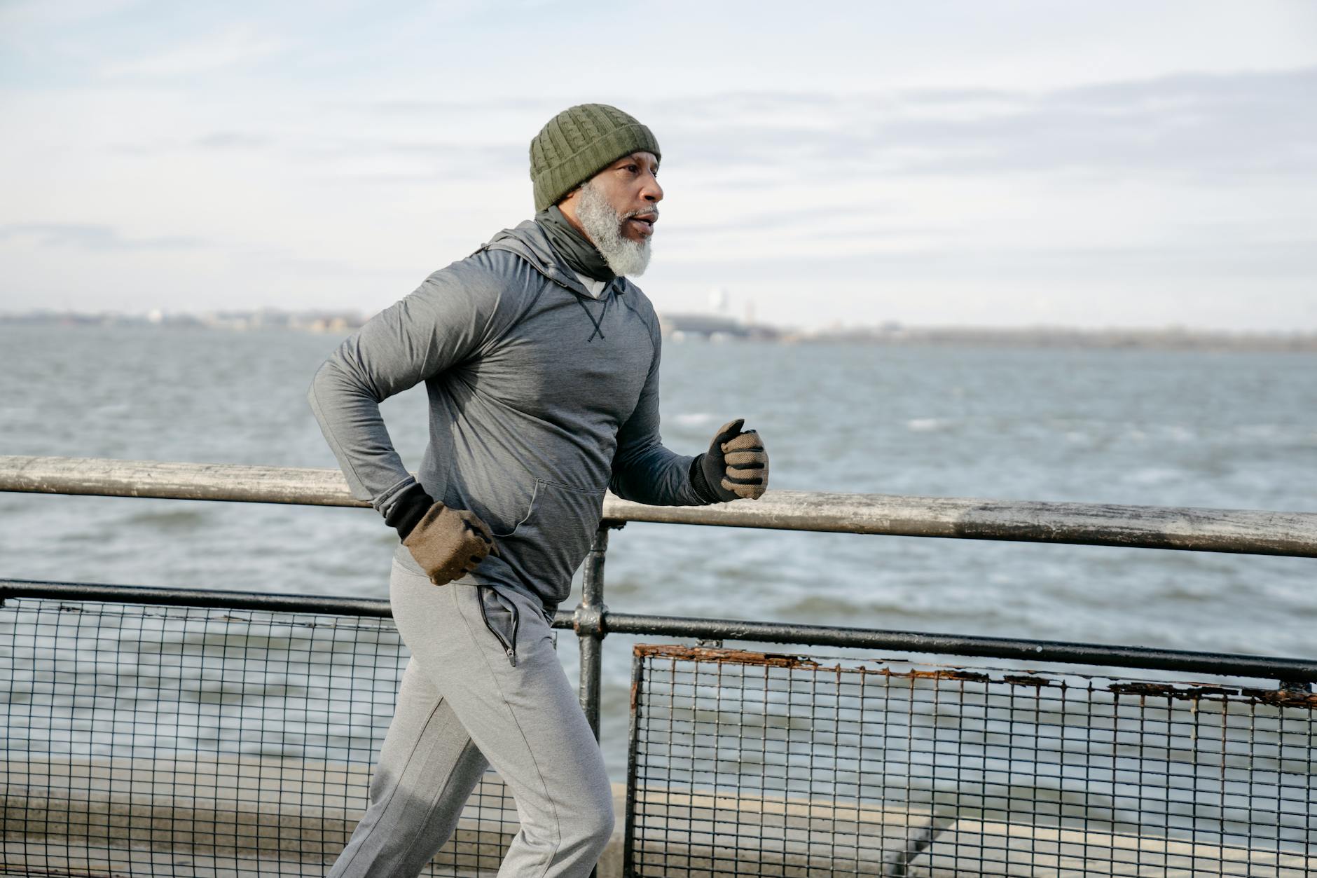 serious black man running on embankment