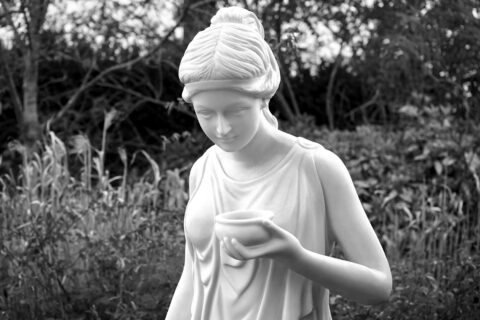 woman holding bowl statue