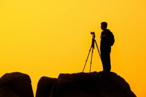 man standing on rock formation