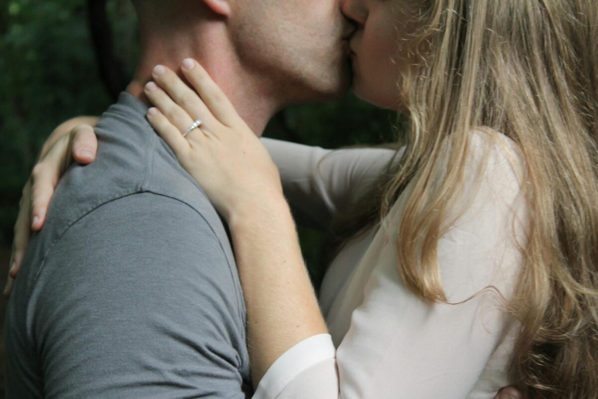 man and woman kissing