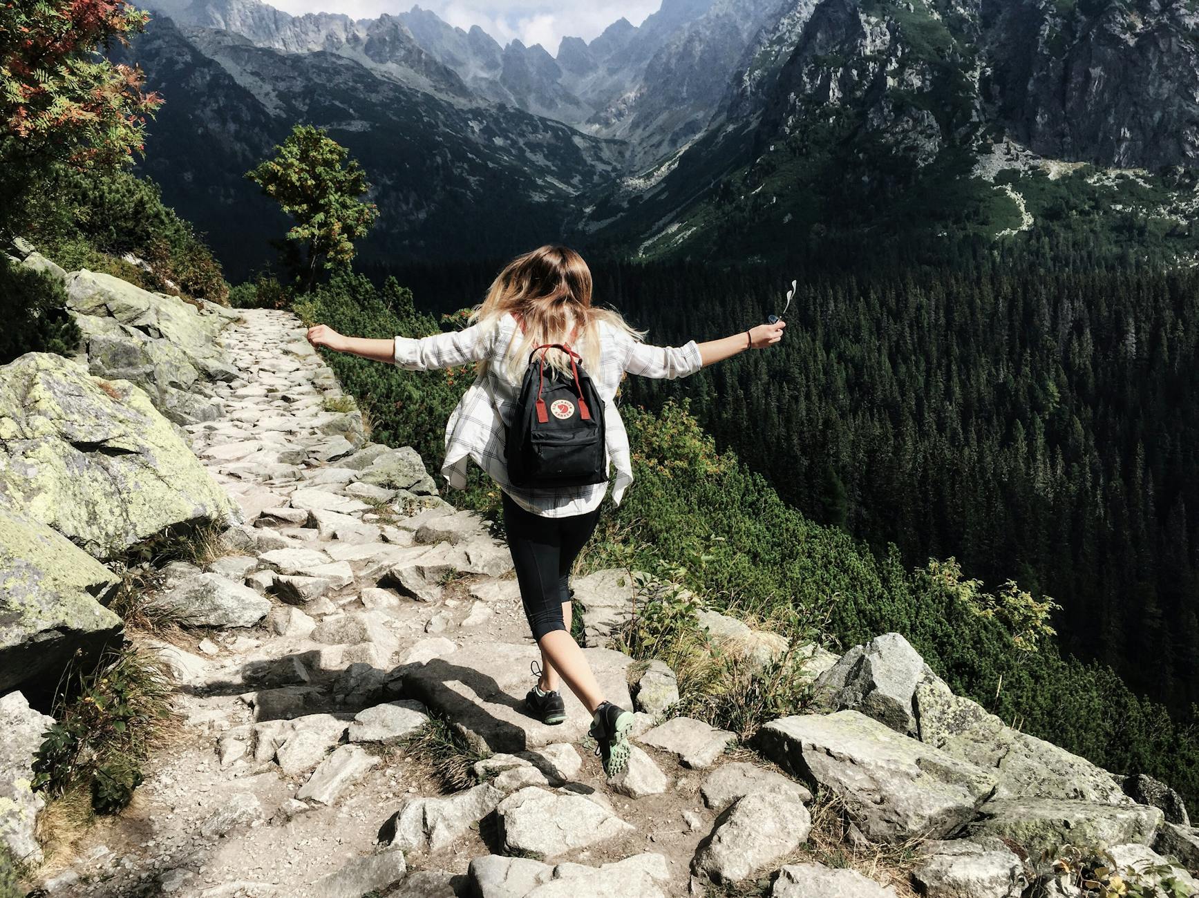 woman standing on cliff